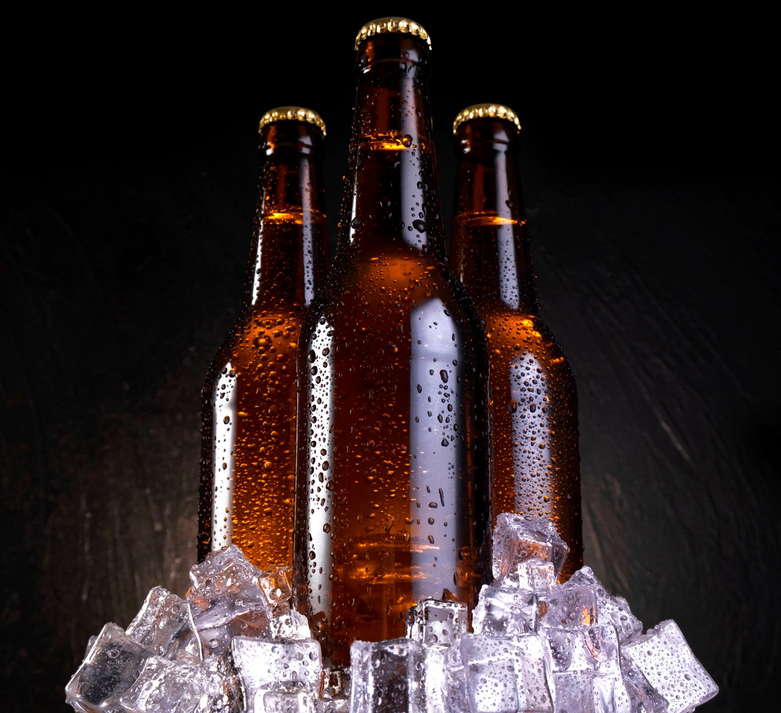 cold beer with water drops beer bottles with ice 2023 11 27 04 52 58 utc scaled